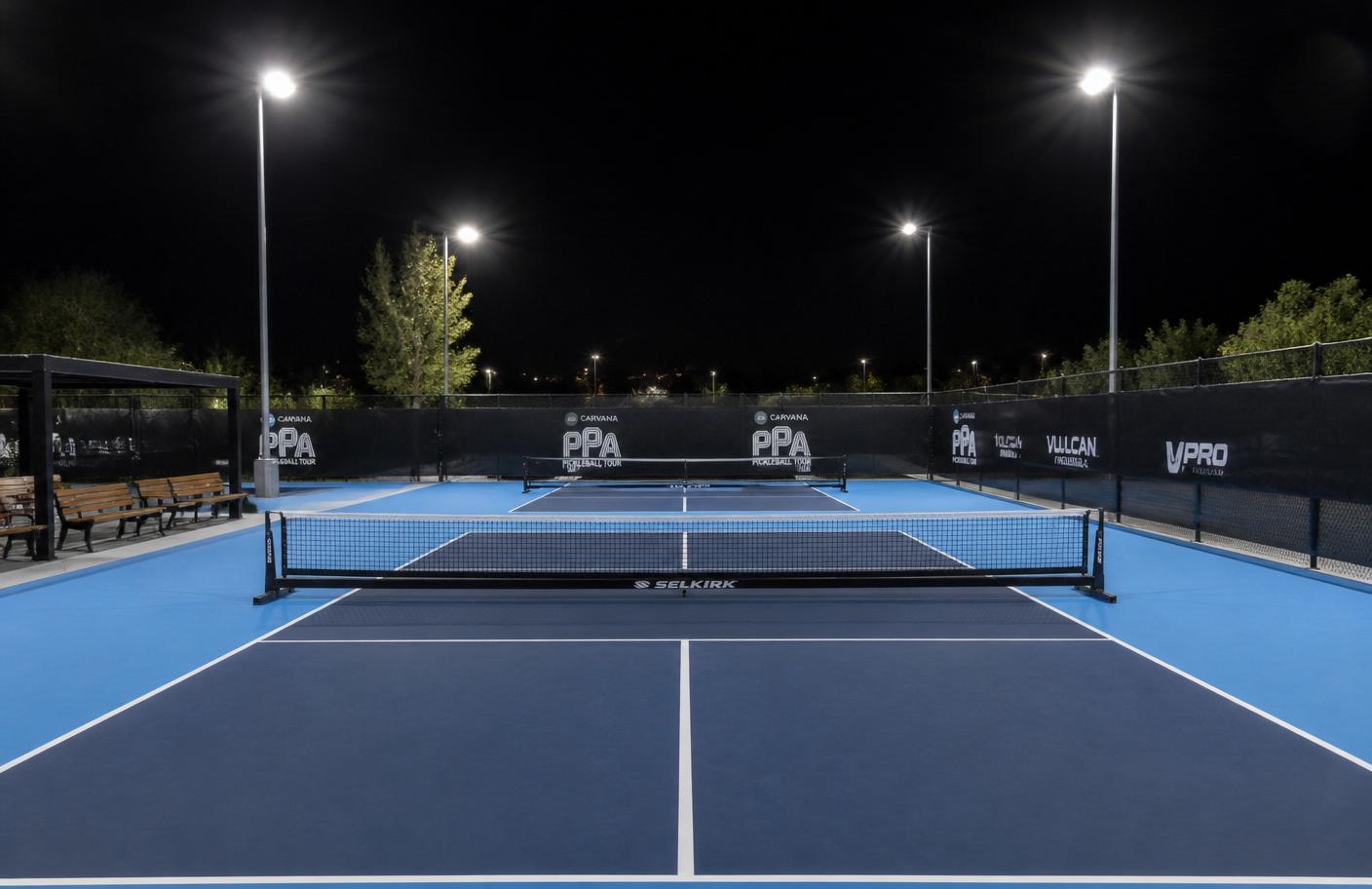 Two private lighted pickleball courts at night